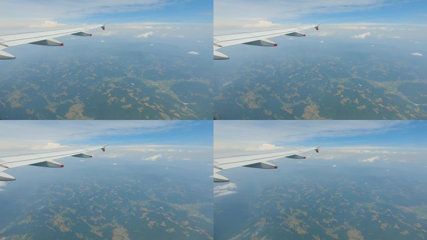 镜头:透过飞机的窗户俯瞰美丽的山区