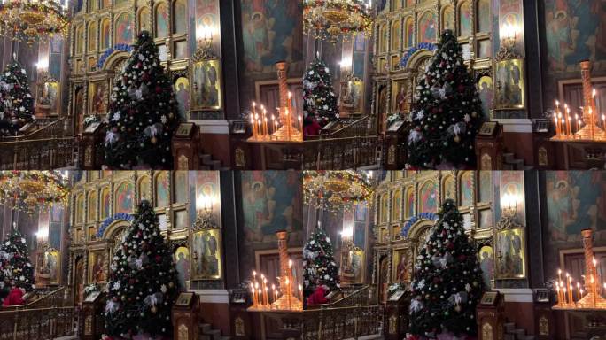 教堂圣诞节东正教教堂内平安夜装饰圣诞树蜡烛美丽的图标耶稣诞生祝贺敲钟庆祝