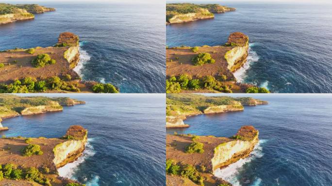 破碎海滩的移动海浪日落场景是巴厘岛努沙佩尼达岛最著名的观光景点之一。这是岩石中形成的一个神奇的马蹄形