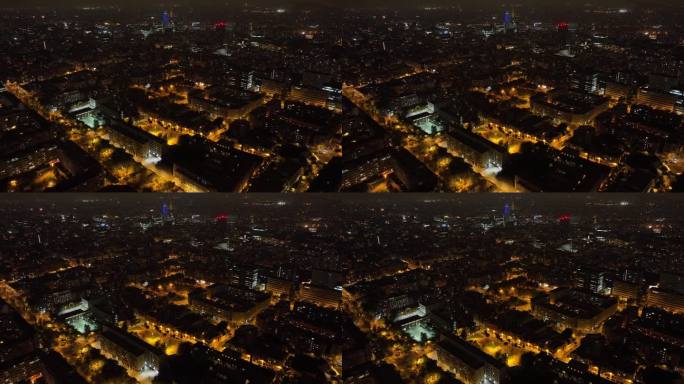 夜间照明飞行在巴塞罗那中心城市景观空中全景4k西班牙