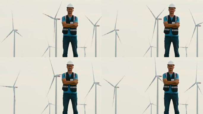 工程师的决心:在风力涡轮机前沉思。拥有风力涡轮机的绿色能源农场。