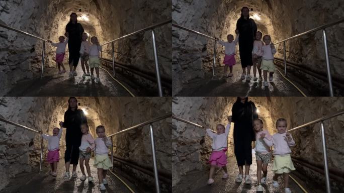 妈妈带着三胞胎姐妹去地下隧道见镜头