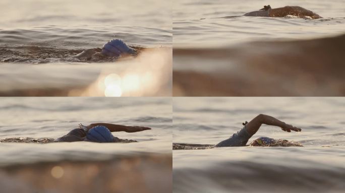 SLO拍摄的活跃的女人在日落期间在海洋游泳度假
