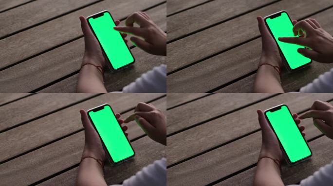 手点击滑动绿色屏幕的智能手机