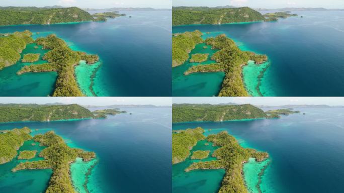 风景优美的飞行在隐藏的斐济群岛，下面是浅的充满活力的珊瑚礁系统。