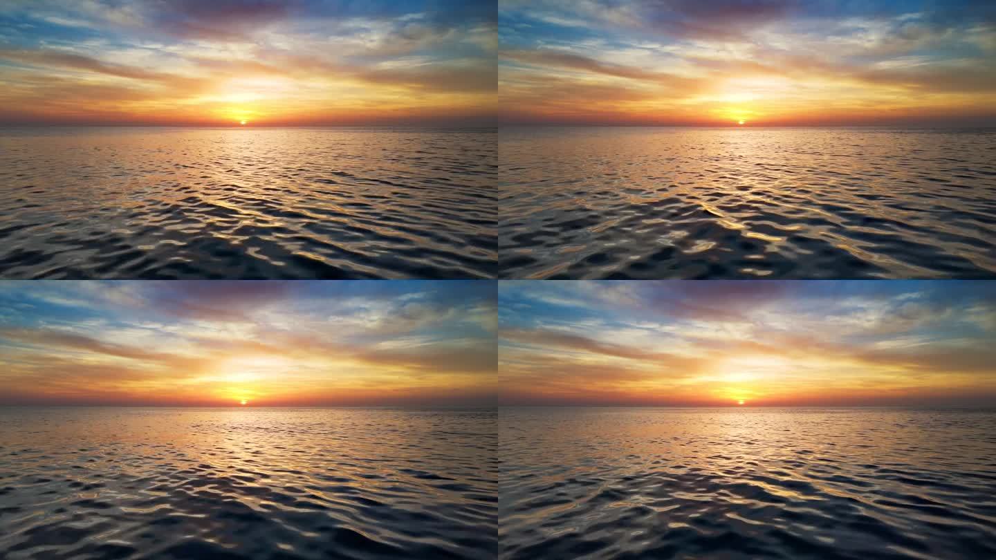大海或大洋上壮丽的日落。在红色的晚霞中飞过水面。阳光反射在海面上，航拍无人机拍摄