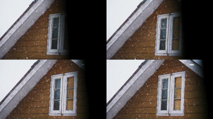 冬天，印度克什米尔古尔玛格，一间阁楼的窗外飘着雪花——特写