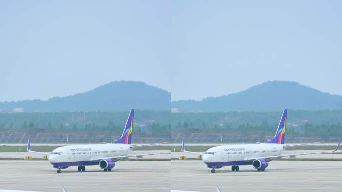 机场停机坪跑道上准备起飞移动的飞机