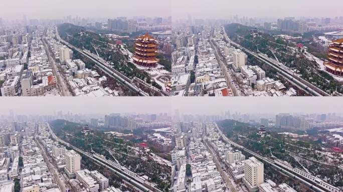 大雪下通过武汉黄鹤楼的客运列车