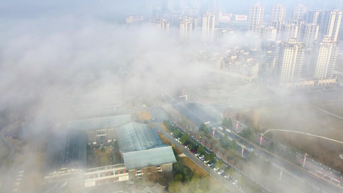 云雾中的城市，汉中大剧院航拍4k