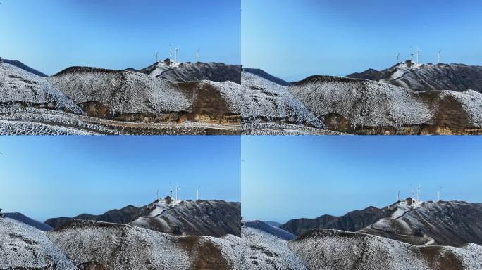 冬季桂林高山上的积雪和风力发电风车