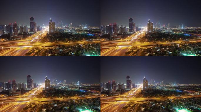 夜间照明迪拜城市景观交通道路交汇处屋顶全景4k延时阿联酋