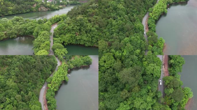 汽车行驶在青山绿水间