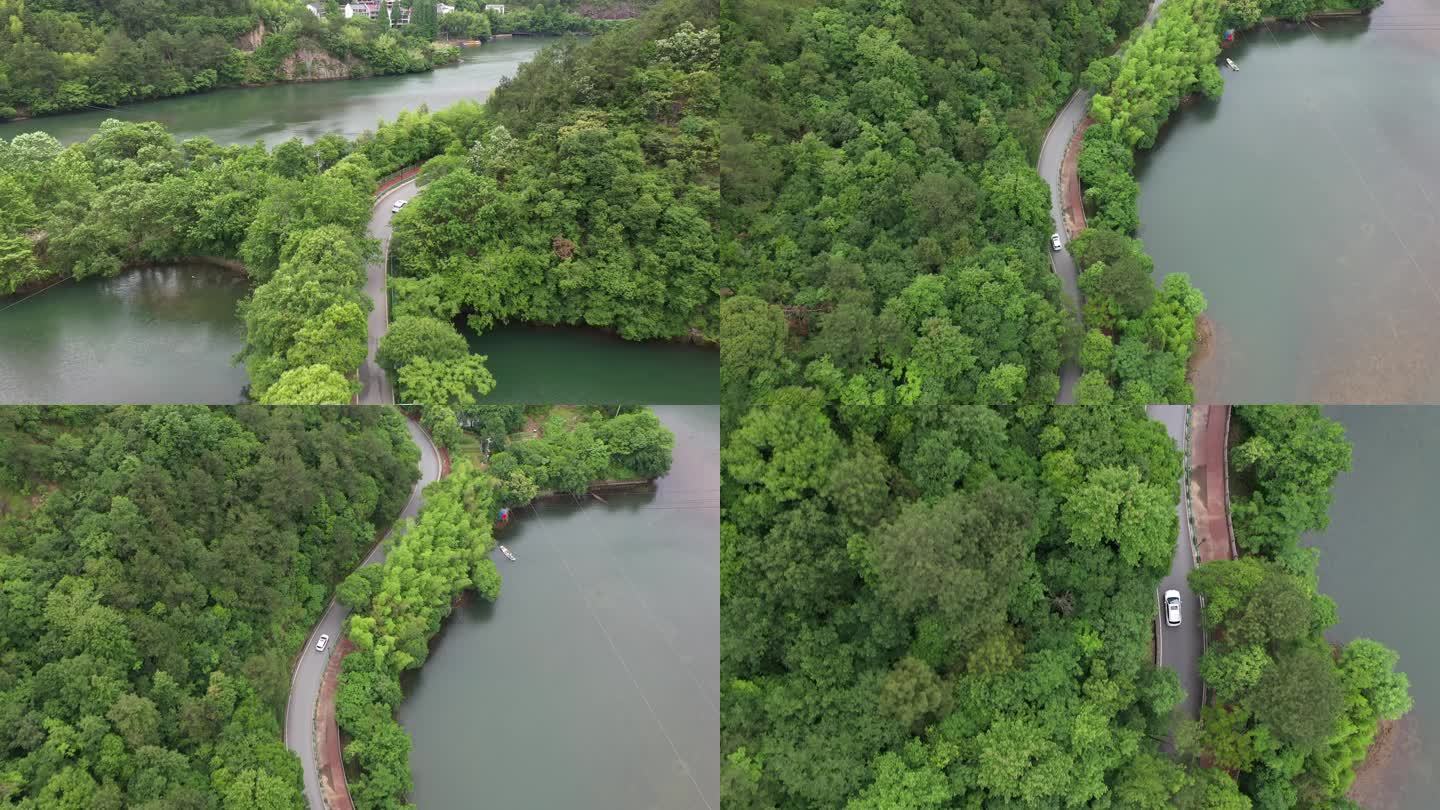 汽车行驶在青山绿水间