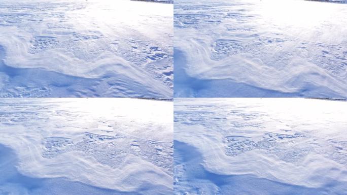 4K航拍雪地白毛风冬天下雪风吹雪北方东北