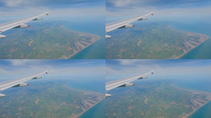 视角:飞行中透过飞机窗户看到的迷人的英国海岸线