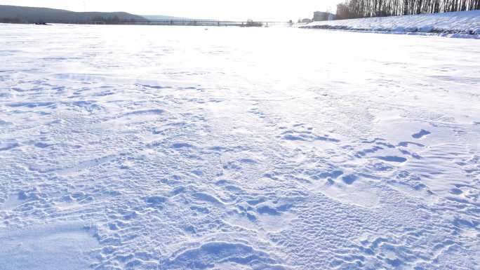 4K航拍雪地白毛风冬天下雪风吹雪北方东北