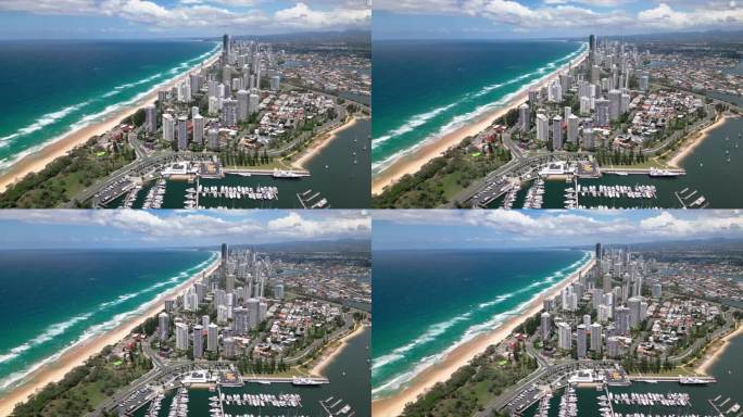 4K鸟瞰图实时俯瞰主要海滩，宽海滩，黄金海岸陆地区域与豪华酒店和港口港口，海滩在黄金海岸，昆士兰，澳