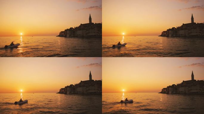 SLO拍摄的游客在船上探索大海在夕阳的天空在假期。罗维尼，伊斯特拉，克罗地亚。