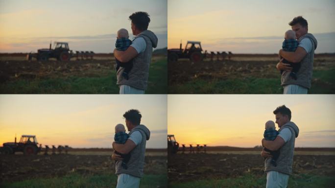 SLO MO Man农民带着儿子，看着拖拉机在夕阳下对着天空犁地。农产品检验。