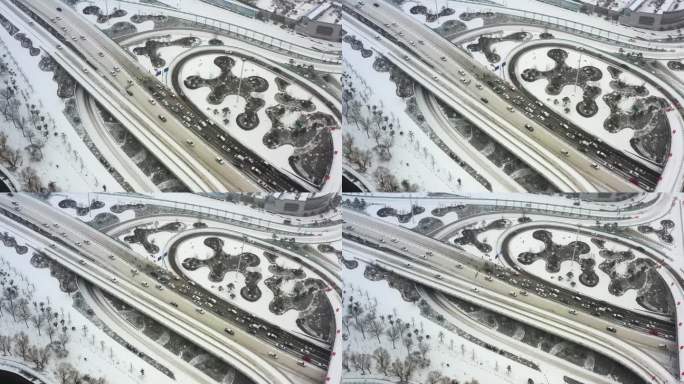 4K航拍汽车行驶在大雪覆盖的道路上