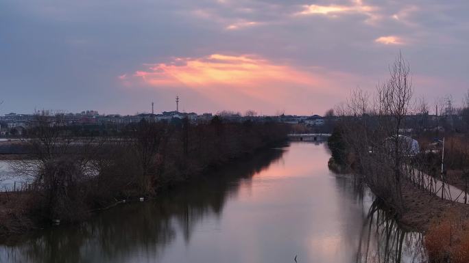 航拍乡村振兴龙型丁达尔光效河流鸟群夕阳