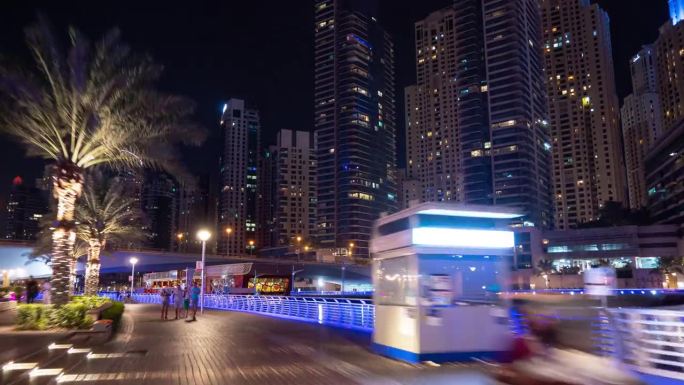 夜间照明迪拜码头著名的旅游海湾步行全景4k延时阿联酋