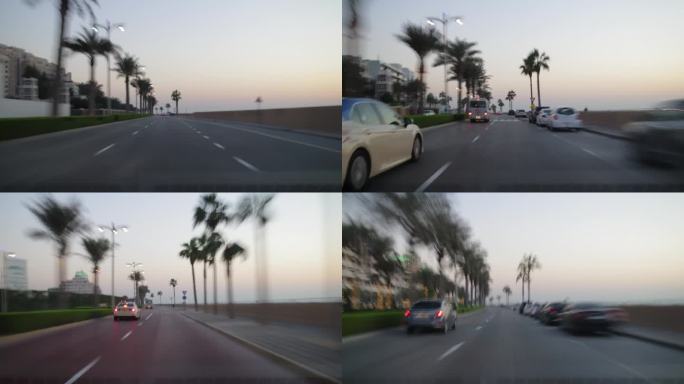 日落时间迪拜市著名的棕榈岛交通街道公路旅行前全景4k延时阿联酋