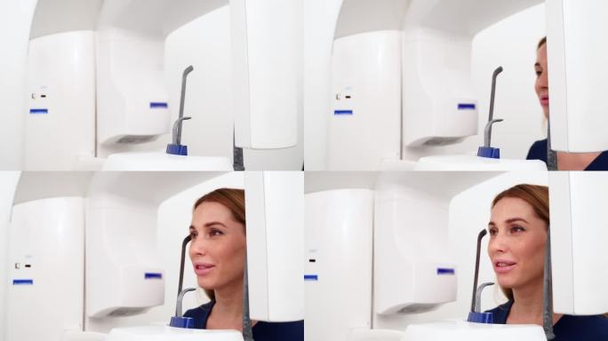 现代牙科门诊女患者做牙齿全景x光片。女病人在医院医疗柜的x光机扫描仪前。年轻女子正在拍摄下巴全景。特