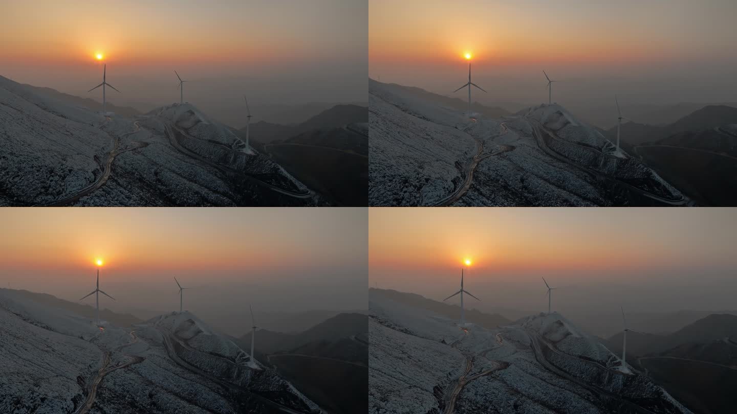 冬天日落下桂林高山上的积雪和风力发电风车
