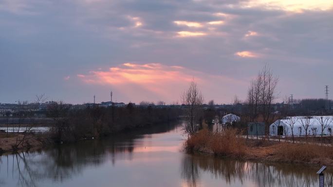 航拍乡村振兴龙型丁达尔光效河流鸟群夕阳