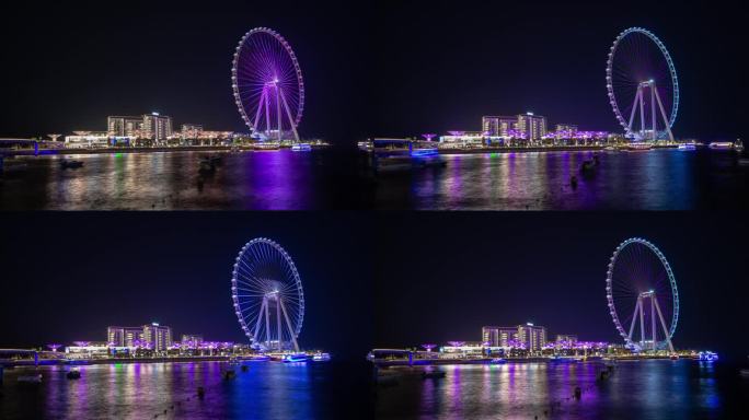 夜间照明迪拜市著名的摩天轮岛海湾全景4k延时阿联酋