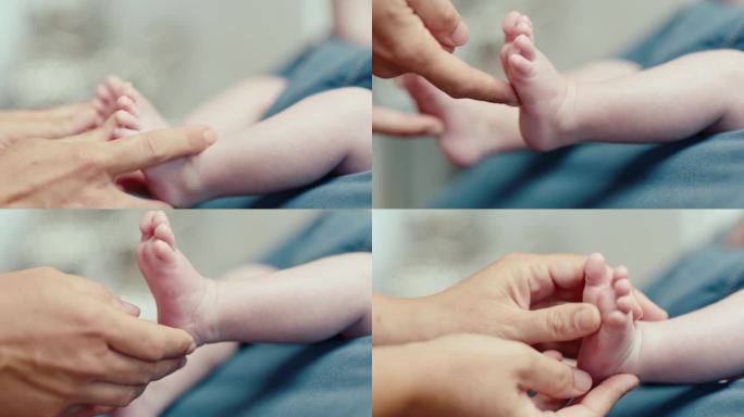 在家里的保镖，妈妈的手抚摸着可爱的宝宝的脚的特写镜头