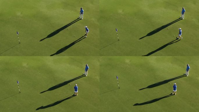 两个高尔夫球手和他们长长的影子