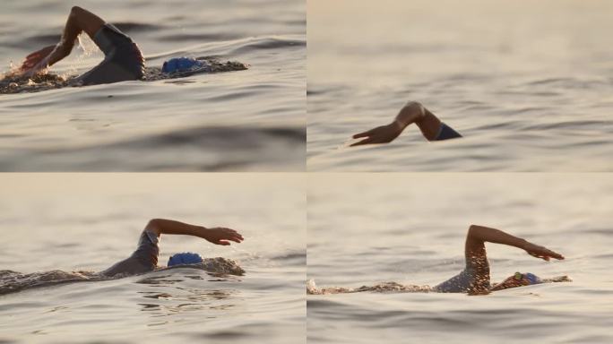 在日落时在海里游泳的度假女性的SLO镜头