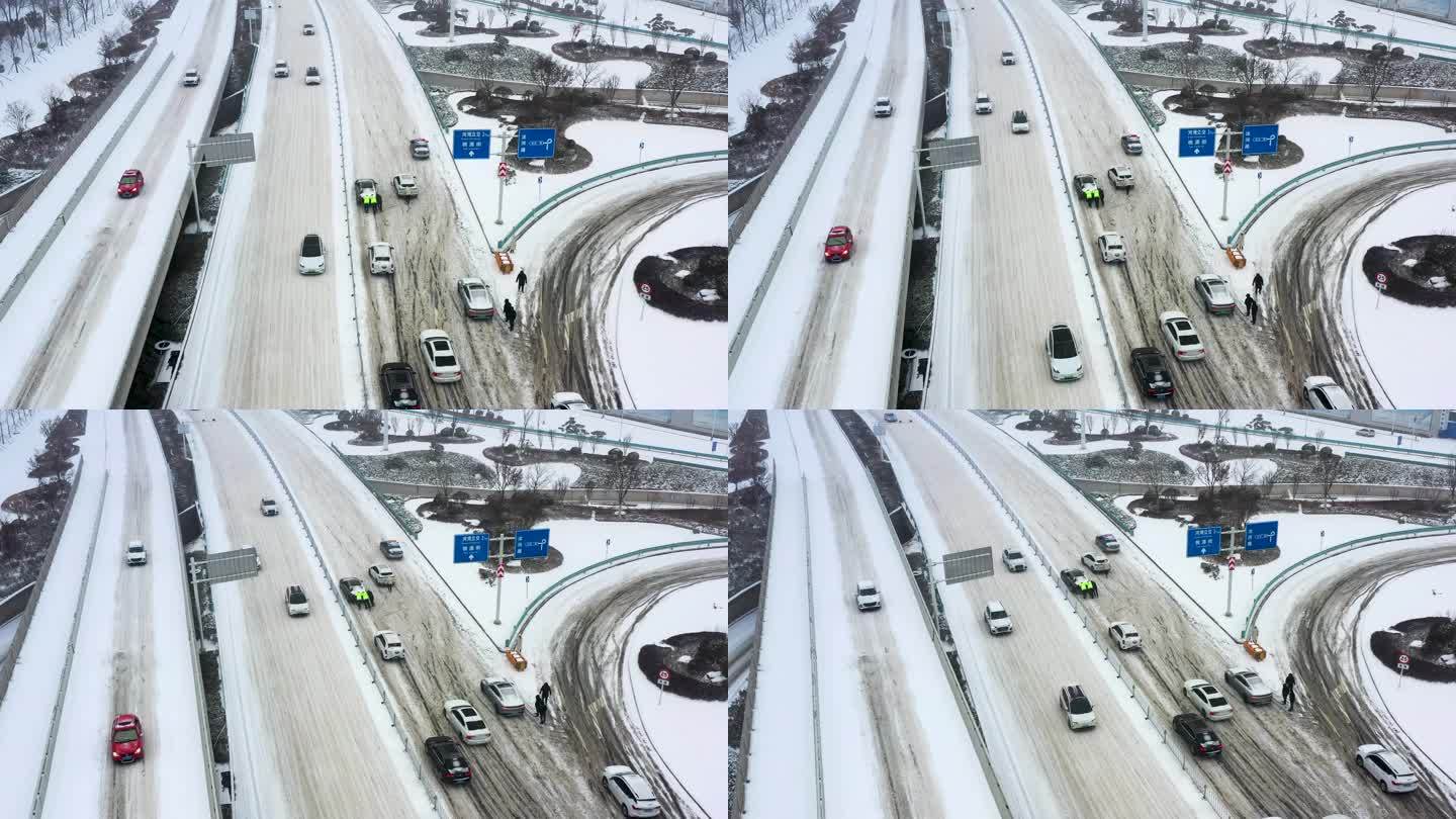 航拍交警下雪天气帮助群众汽车脱困的场景