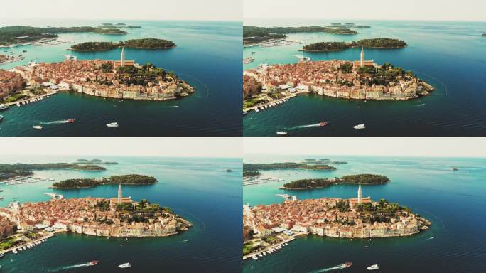 航拍无人机拍摄的历史古城与建筑和钟楼在亚得里亚海海景在克罗地亚波雷茨