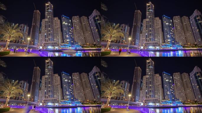 夜晚照亮著名的迪拜码头市中心拥挤的步行海湾全景4k延时阿联酋