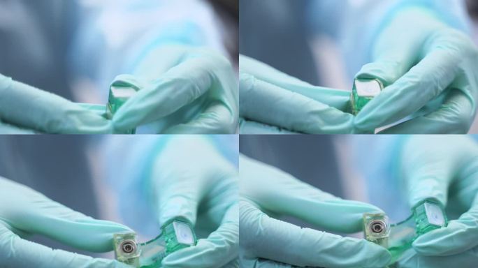 牙齿植入物在牙医手中的特写镜头。口腔外科医生在现代牙科诊所展示钛种植体。植入手术正在进行中。牙科钛种