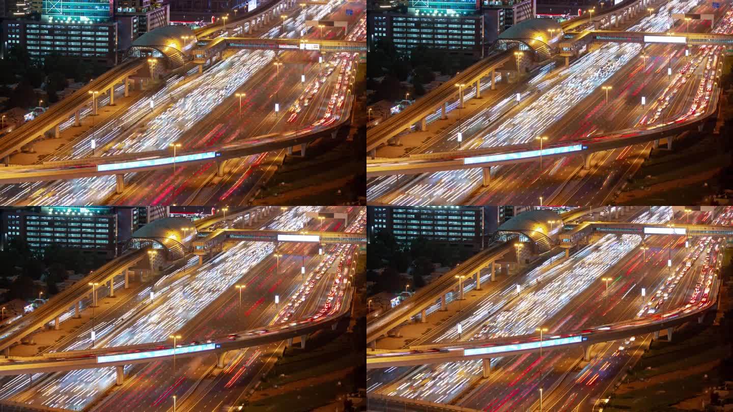 夜间照明迪拜城市主要交通道路交汇处高峰时间屋顶全景4k延时阿联酋