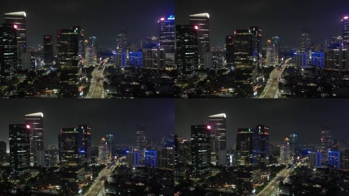 夜间照明雅加达市区现代办公大楼交通街道道路航拍全景4k印尼
