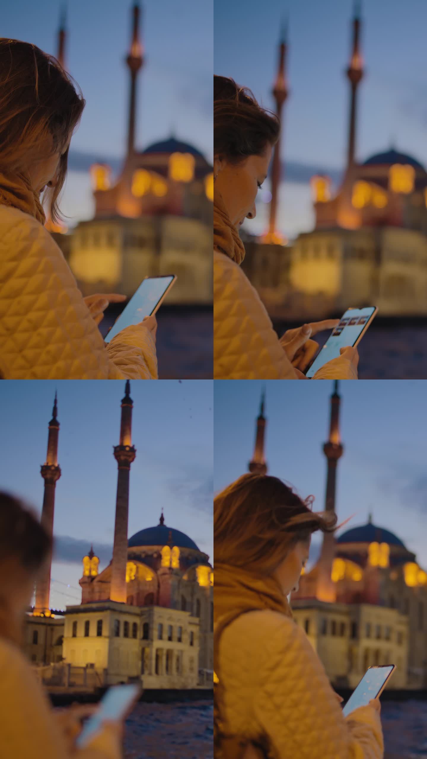 7月15日，一位手持智能手机的女子在Ortakoy清真寺与烈士桥合影#Ortakoy清真寺#烈士桥景