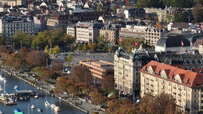 阳光明媚的一天，飞越苏黎世湖畔著名的歌剧院广场鸟瞰图4k瑞士