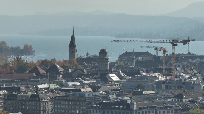 晴朗的一天飞越苏黎世市中心建筑起重机湖滨区航拍全景4k瑞士