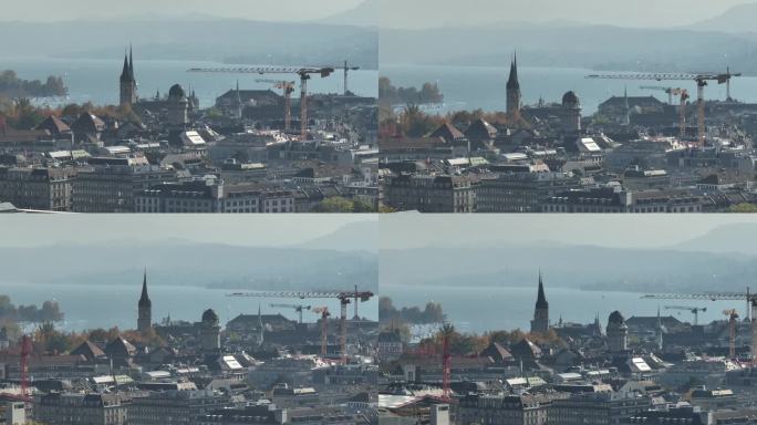 晴朗的一天飞越苏黎世市中心建筑起重机湖滨区航拍全景4k瑞士