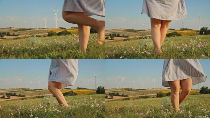 快乐的革命:女人在野花和风力涡轮机中旋转