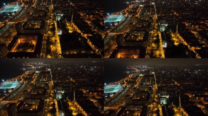 夜间照明飞行在巴塞罗那城市街区交通街道航拍全景4k西班牙