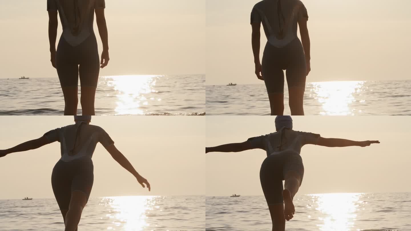在日落海滩练习瑜伽时，穿着潜水服单腿平衡的女子的慢镜头