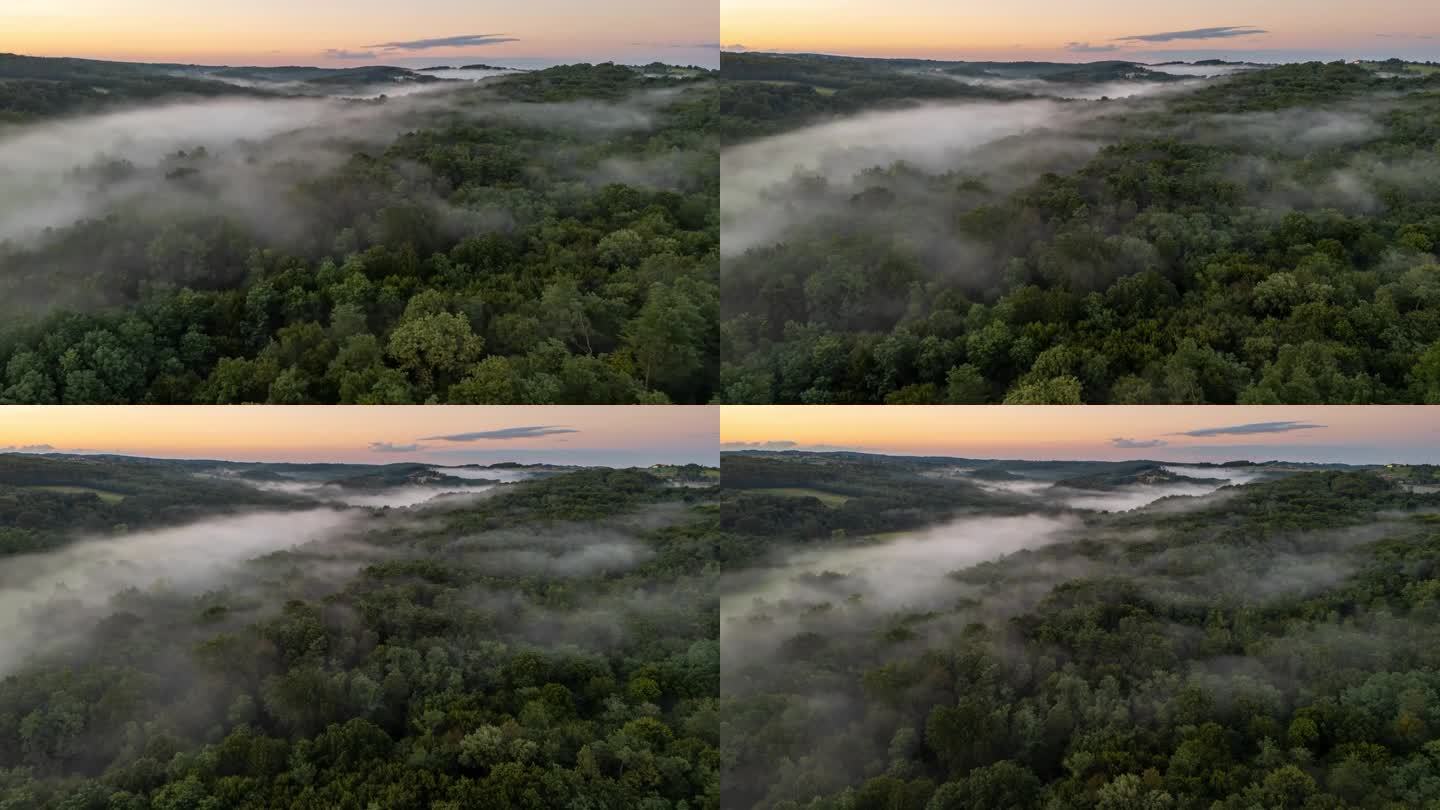 超延时延时雾在树梢和景观。雾笼罩森林。
