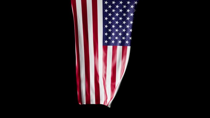 美国国旗卷成圆柱形，在旋转时展开并起伏